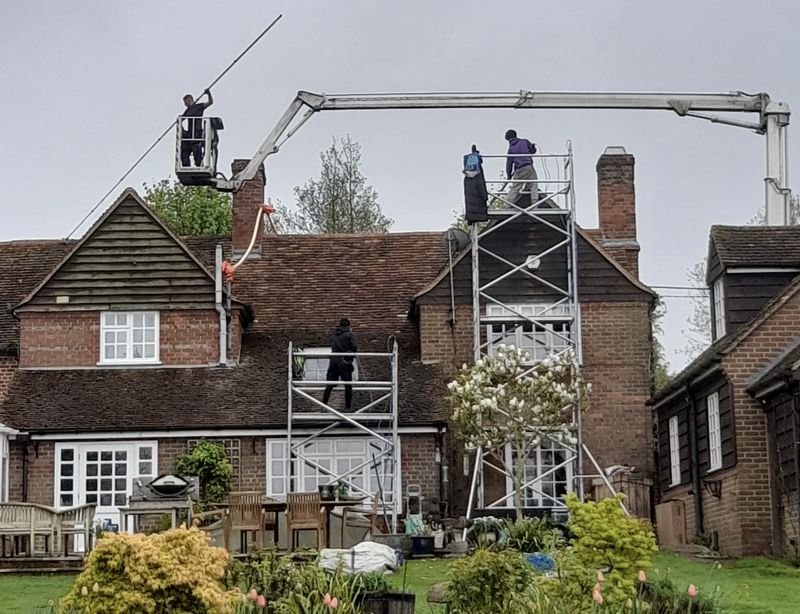 The Roof Moss Cleaners using cherry picker and scaffolding to clean roof safely and professionally in Redbourn, Hertfordshire